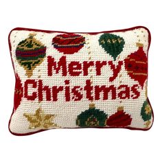 a red and white christmas pillow with ornaments on it, the words merry christmas are written in