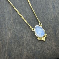 A feminine & timeless necklace with an enchanting drop-shaped Moonstone. The Moonstone is decorated with dotted details at the lower edge. Perfect for layering or worn alone for a simple but stylish look. The brass has a warm gold tone & is nickel-free. The Moonstone represents femininity, intuition, balance & wishes. ～As Ancient as the Moon itself～ Size Guide: Adjustable size Length: 35 - 45 cm Material: Brass (nickel-free) Stone: Moonstone 10x14 mm Back to storefront: www.etsy.com/ Bohemian Moonstone Jewelry With Teardrop Shape, Bohemian Moonstone Teardrop Jewelry, Bohemian Teardrop Necklace With Adjustable Chain, Elegant Moonstone Jewelry For Festivals, Moonstone Teardrop Pendant Necklace With Gemstone, Bohemian Moonstone Teardrop Pendant Jewelry, Bohemian Moonstone Teardrop Pendant Necklace, Teardrop Moonstone Gemstone Necklace, Teardrop Moonstone Necklace With Natural Stones