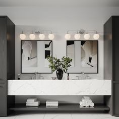 a bathroom with double sinks and two mirrors