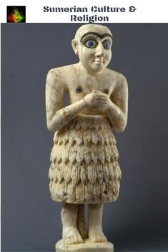 an ancient statue is standing with his hands folded in front of his chest and eyes wide open