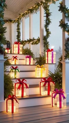 christmas presents are on the steps decorated with lights and garlands for an outdoor display