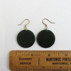 "A pair of earrings that I made with vintage green bakelite discs that have a subtle marbled pattern. They also have a very nice and unusual translucency as you can see in some of the photos. I also used all solid brass pierced hardware. Discs are about 1 1/16\" in diameter; about 1 7/8\" for length from top of ear wire to bottom of dangle. This is the exact pair you will receive. I also have them in a butterscotch and red bakelite: www.etsy.com/listing/129854329/butterscotch-bakelite-earrings-p Vintage Green Brass Earrings, Handmade Round Bakelite Jewelry, Vintage Jade Round Earrings, Vintage Green Patina Earrings, Retro Round Bakelite Jewelry, Vintage Hallmarked Green Earrings, Vintage Nickel-free Enamel Earrings, Pierced Earrings, Brass Hardware