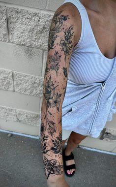 a woman with a tattoo on her arm