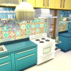 a kitchen with blue cabinets and white stove top oven next to a green countertop