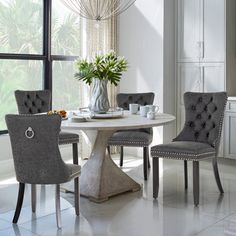 a dining room table with chairs around it