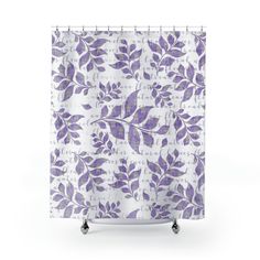 a shower curtain with purple leaves on it and the words, love is in the air