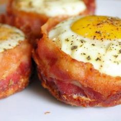 bacon egg muffins cups on a plate with the words bacon egg muffin cups