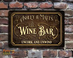 a sign on the side of a brick wall that says whiskey and mats wine bar