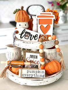 a basket filled with pumpkins and other items