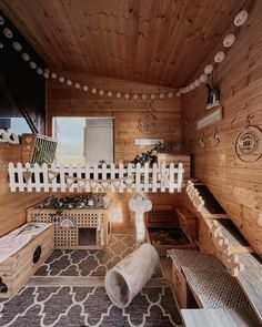 the inside of a cabin with wooden walls and flooring