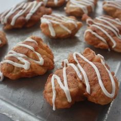 there are many cookies with white icing on them