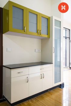 an empty kitchen with cabinets and cupboards on the wall next to hardwood flooring