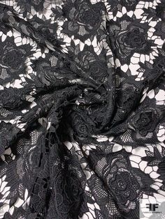 black lace with white flowers on it