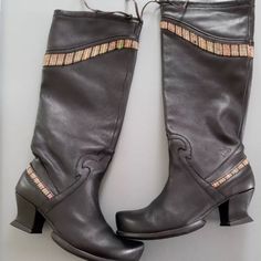 Pair Of *Gorgeous* John Fluevog Black Leather Knee High Boots In Excellent Condition. Size 11, Rare, Distinctive Toe And Heel, Pull On Style, Metal Tipped Cinch Cords, Textile Inset Panels, Logo Embossed On Sides, Leather Lining. Approx. Measurements: Shaft 16", Heel 2". Take My Word For It (I Have A Pair Myself) These Boots Are Oh Sooooooo Comfortable! Black Leather Knee High Boots, John Fluevog Shoes, Leather Knee High Boots, John Fluevog, Size 11 Heels, Shoes Heels Boots, Knee High Boots, High Boots, Shoes Women Heels