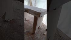 three different angles of a wooden bench