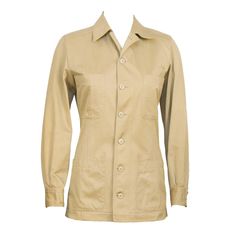 1990’s Yves Saint Laurent Rive Gauche safari style jacket in cotton khaki. The jacket buttons down the front and features four pockets at the breast and at the hips, finished with a buttoned barrel cuff. In excellent condition. Fits like a US 4. Hermes Paris Jacket, Luxury Khaki Outerwear For Spring, Luxury Khaki Outerwear With Double Button Closure, Luxury Khaki Outerwear With Lapel Collar, Luxury Vintage Beige Outerwear, Luxury Fitted Vintage Utility Jacket, Luxury Khaki Outerwear With Zipper Closure, Luxury Vintage Single Breasted Utility Jacket, Luxury Vintage Utility Jacket With Buttons