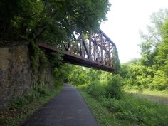 an old train bridge over a small river