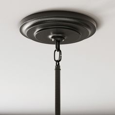 a black light fixture with a chain hanging from it's center point and two lights on each side