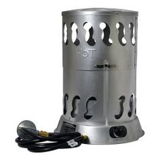 a large metal stove sitting on top of a white floor next to a power cord