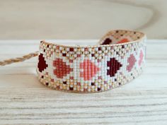 a close up of a bracelet on a table