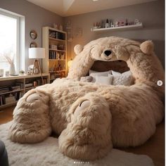 a large teddy bear sitting on top of a bed