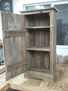 an old wooden cabinet is being worked on