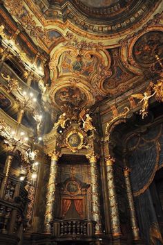 an ornately decorated room with chandeliers and lights