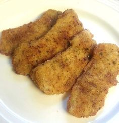 chicken sticks on a white plate ready to be eaten