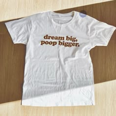 Dream Big, Poop Bigger TShirt is a funny statement tee to wear when you're suffering from IBS, diarrhea or you just generally love to poop. This funny t shirt will surely make everyone laugh or get you weird looks wherever you go. Wear this meme shirt in your school, at the park, on your daily strolls and wait for everyone to laugh at your motivational weird shirt! This poop shirt can also be a funny gift or weird gift for anyone you know who loves pooping as this funny motivational shirt is uni Sean Leonard, Funny Gifts For Her, Funny Statements, Weird Gifts, Tshirt Funny