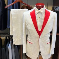 Step Into Luxury With This Custom-Made, White Tuxedo, Featuring Striking Red Lapels And Pocket Trims. Size Approximates A 39 Regular With A Slim Fit, Ideal For Someone Between Sizes 38-39. The Jacket Boasts A One-Button Notch Design With Jetted Pockets, Enhancing Its Sleek Look. Paired With A Red Vest That Has White Lapels And Elegant Pick Stitching, This Ensemble Stands Out In Any Crowd. Made From High-Quality Florida Cloth, This Suit Was Initially Crafted For A Client Who Didn't Pick It Up, Of Red And White Suits For Men, Luxury Red Tuxedo For Wedding, Red And White Suit, Luxury Red Wedding Tuxedo, Designer White Party Suits, Luxury White Suit For Parties, Luxury White Party Suit, Designer Fitted White Tuxedo, Designer White Wedding Suit