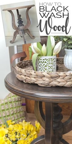 a wooden table topped with a basket filled with flowers next to a sign that says how to black wash wood