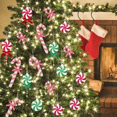 a christmas tree decorated with candy canes and stockings