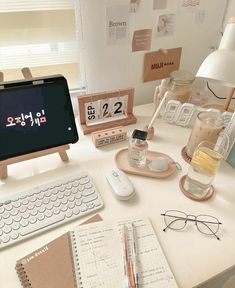 an office desk with various items on it