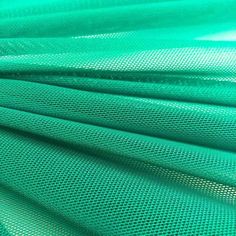 green mesh fabric is shown in close up