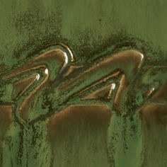 an abstract photograph of green and brown colors