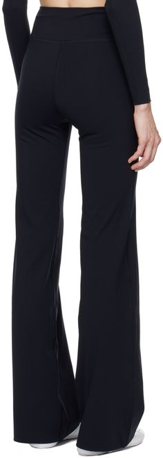 Flared stretch nylon jersey lounge pants. · Reflective logo printed at leg · Welt pocket at inner waist Supplier color: Black/Reflective Sportswear Elastane Lounge Pants, Moisture-wicking Mid-rise Pants For Loungewear, Moisture-wicking Mid-rise Lounge Pants, Athleisure Go-dry Straight Leg Pants, Fitted Go-dry Pants For Loungewear, Baggy Sweatpants, Cotton Sweatpants, Balenciaga Black, Black Activewear