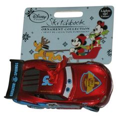 a red toy car with mickey mouse on it