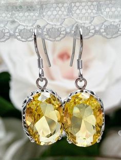 Customize your earrings with a choice of closures; traditional ear wires/hooks, floral posts, or lever backs Classic Yellow Oval Earrings, Yellow Filigree Jewelry, Yellow Oval Citrine Earrings, Yellow Citrine Earrings For Wedding, Yellow Oval Gemstone Earrings, Elegant Oval Topaz Earrings, Classic Citrine Earrings, Yellow Earrings With Intricate Design For Gift, Elegant Oval Citrine Earrings