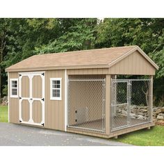 a small dog house with a fence around it and a door on the outside side