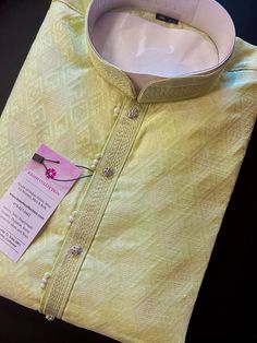 "Premium quality Lime Color Silk Men's Kurta Pajama Set with design pattern all over the Kurta. The neckline has lace work and fancy buttons.  Item : Men's Kurta Pajama Ready to Wear : Yes Pocket : Yes Kurta Color : Lime , Lemon Color (Family of Green Color) Pajama Color : Cream/White  Fabric : Silk Lining : Yes  Work : Fancy buttons, Lace Work Pattern : Designer Disclaimer -For sizing please refer to the Size Chart given in the listing with the pictures. - Please do NOT go by the size of the Ku Pista Green Cotton Sherwani With Chikankari Embroidery, Pista Green Cotton Sherwani For Diwali, Pista Green Cotton Sherwani For Wedding, Wedding Sherwani In Pista Green Cotton, Traditional Pista Green Cotton Sherwani, Pista Green Cotton Sherwani For Eid, Couple Dresses, Men's Kurta Pajama, Wedding Kurta