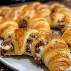 a white plate topped with pastries on top of a table