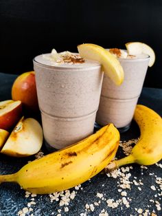 two cups with oatmeal, bananas and apples