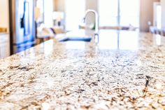 a counter top in a kitchen next to a sink