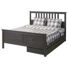 a bed with two drawers underneath it and a checkered comforter on the bottom