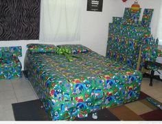 a bed with green and blue wrapping on it