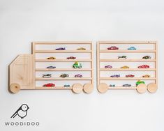 two wooden shelves with toy cars on them and a wall mounted shelf for children's toys