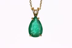 Featured here is a stunning, pear emerald pendant in fine 14k yellow gold. Displayed in the center is a medium-rich green emerald set in a gold four-prong classic mount. The earth mined, green emerald has a desirable lush green color. This emerald is 100% earth mined and is not perfect! Gorgeous flaws are seen within the stone, embrace uniqueness! ( 18 Inch Chain included ) Setting Style: Solitaire - Prong Setting Material: 14K Yellow Gold Gold Weight: 1.3 grams Main Stone: Emerald Shape: Pear C Fine Jewelry Emerald Necklace With Pear Gemstone, Fine Jewelry Pear-shaped Emerald Necklace For Anniversary, Yellow Gold Teardrop Emerald Necklace For Formal, Teardrop Emerald Necklace In Yellow Gold For Formal Occasions, Teardrop Yellow Gold Emerald Necklace For Formal Occasions, Formal Teardrop Emerald Necklace In Yellow Gold, Pear-shaped Emerald Necklace For Anniversary, Formal Yellow Gold Teardrop Emerald Necklace, Formal Emerald Teardrop Pendant Necklace