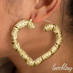 There is nothing more stylish than a pair of 10k Yellow Gold Heart Shaped Bamboo Hoop Earrings. They're a versatile look that can be paired with any kind of outfit and are suitable for any occasion. The click-snap earring closures support a full hoop shape that is crafted in resilient, eye-catching 10k Yellow Gold. Its gold composition is tougher than most gold types, allowing it to withstand years of daily wear. These hoops measure 2.90 inches from side to side and 2.40 inches from top to botto Xoxo Jewelry, Gold Everything, Clean Gold Jewelry, Bamboo Hoop Earrings, Gold Heart, Gold Hoop Earrings, Heart Of Gold, Heart Earrings, Gold Chains