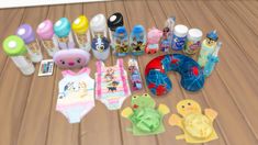 there are many baby items on the wooden floor next to bottles and other things in front of them