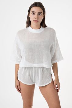 Featuring a classic mock neck silhouette and oversized fit, this crop top has a beachy nostalgic feel. Our cotton mesh fabric is knit locally to be breathable and lightweight, making it a universal summer staple. For a monochromatic look, we recommend wearing the RIN304GD Cotton Fishnet Shorts in a matching color. This item can also be layered with any of our swimsuits, intimates, performance wear, or bodysuits. Great for lounging, sleeping, water activities, working out, and sweating. | Cotton Fishnet Shorts, Fishnet Crop Tops, Los Angeles Apparel, Garment Manufacturing, Blue Black Color, Mid Length Sleeves, Performance Wear, Sweaters And Leggings, Summer Staples